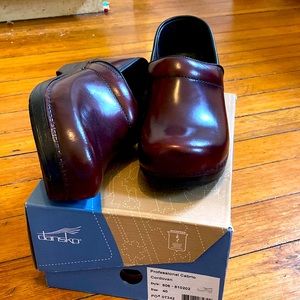 Dansko clogs- brand new in box. Women’s size 40 (9). Deep red color.